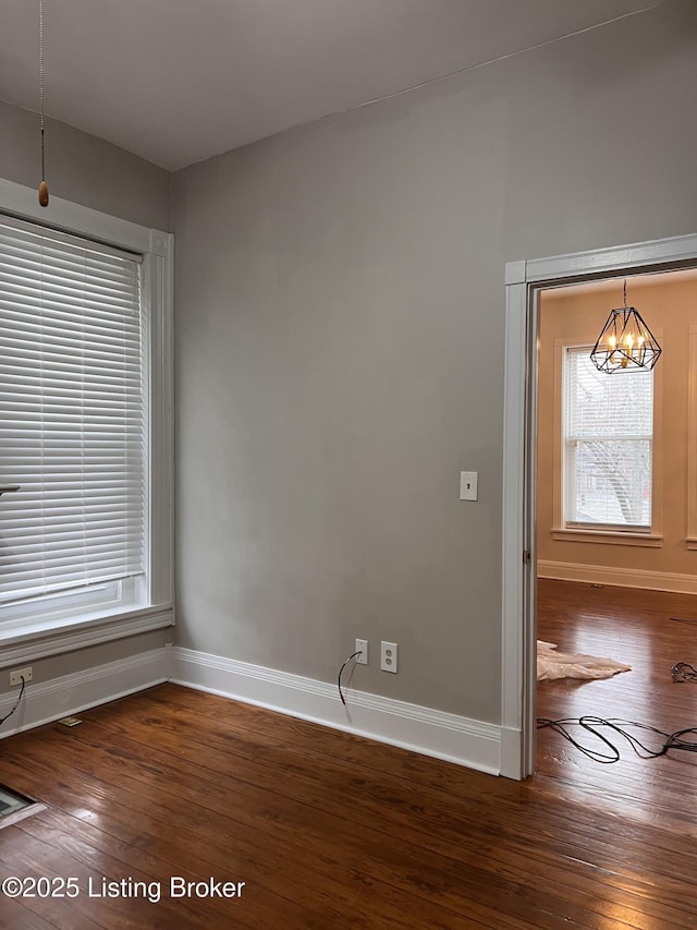 1308 S 2nd St, Louisville, KY 40208 - unfurnished room with hardwood / wood-style floors and a chandelier