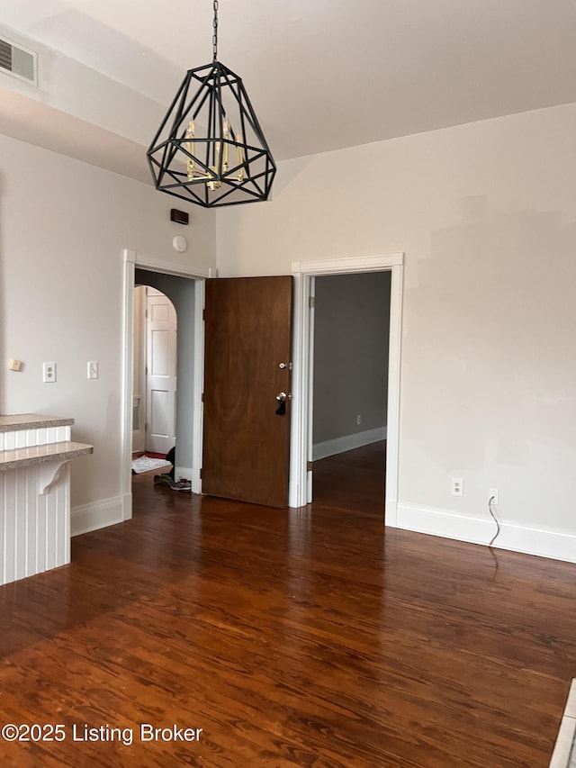 1308 S 2nd St, Louisville, KY 40208 - unfurnished dining area featuring arched walkways and dark wood finished floors