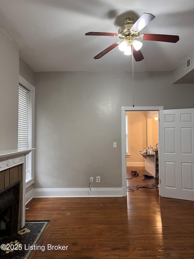 1308 S 2nd St, Louisville, KY 40208 - unfurnished living room with a ceiling fan, wood finished floors, and a fireplace