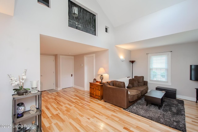 129 E Park Pl, Jeffersonville, IN 47130 - living area featuring light wood-type flooring and high vaulted ceiling