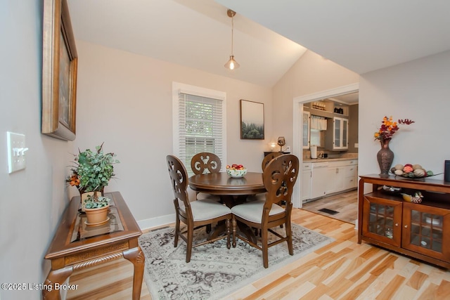 129 E Park Pl, Jeffersonville, IN 47130 - dining room featuring light wood-type flooring and vaulted ceiling