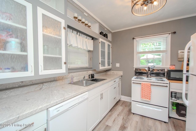 129 E Park Pl, Jeffersonville, IN 47130 - kitchen with white appliances, crown molding, light wood-type flooring, white cabinets, and glass insert cabinets