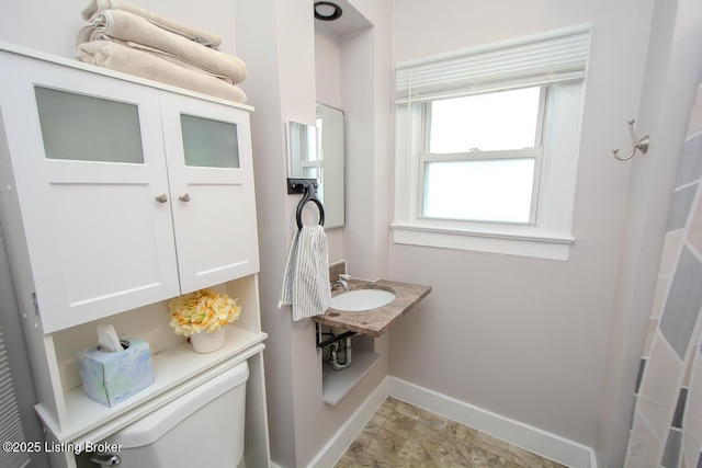 129 E Park Pl, Jeffersonville, IN 47130 - bathroom with baseboards and stone finish flooring