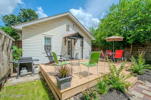 129 E Park Pl, Jeffersonville, IN 47130 - back of house with a wooden deck, a fenced backyard, and outdoor dining space