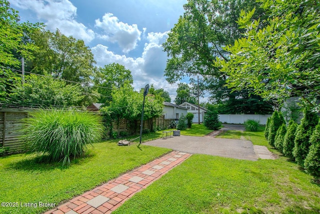 129 E Park Pl, Jeffersonville, IN 47130 - fenced backyard with a patio area