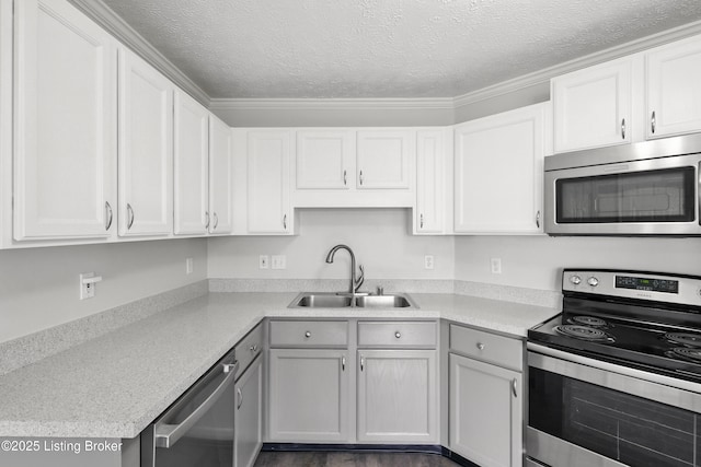 11411 Catalpa View Ct, Louisville, KY 40299 - kitchen featuring appliances with stainless steel finishes, a textured ceiling, light countertops, and white cabinetry