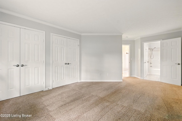 11411 Catalpa View Ct, Louisville, KY 40299 - unfurnished bedroom with multiple closets, ornamental molding, carpet flooring, and connected bathroom