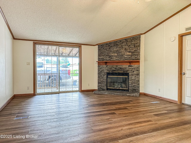 77 Old Ky 259th Rd, Mcdaniels, KY 40152 - unfurnished living room with crown molding, lofted ceiling, a textured ceiling, wood finished floors, and a fireplace