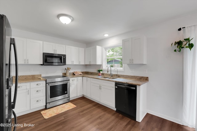 122 Appletree Way, Shelbyville, KY 40065 - kitchen with stainless steel appliances, dark wood-style floors, white cabinetry, and light countertops
