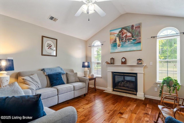 11300 Rdg Lake Dr, Louisville, KY 40272 - living room with wood-type flooring, vaulted ceiling, ceiling fan, and a glass covered fireplace