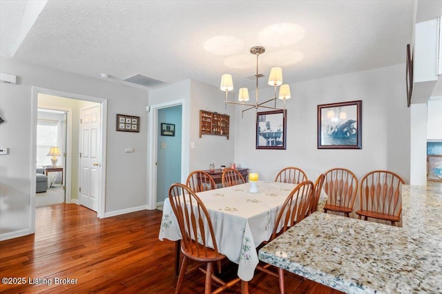 11300 Rdg Lake Dr, Louisville, KY 40272 - dining space featuring a chandelier, wood finished floors, and a textured ceiling