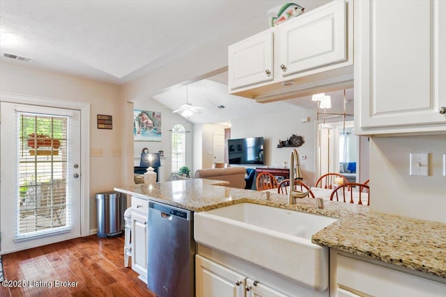 11300 Rdg Lake Dr, Louisville, KY 40272 - kitchen featuring stainless steel dishwasher, vaulted ceiling, wood finished floors, a ceiling fan, and white cabinetry