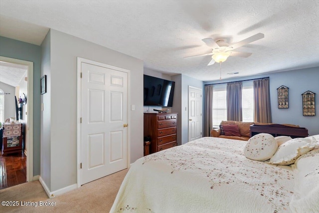 11300 Rdg Lake Dr, Louisville, KY 40272 - bedroom featuring light carpet, a closet, a textured ceiling, and ceiling fan