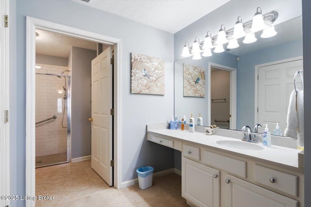 11300 Rdg Lake Dr, Louisville, KY 40272 - bathroom with a stall shower, vanity, and a textured ceiling