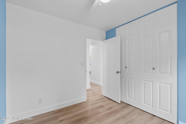 4900 Glenna Way, Louisville, KY 40219 - unfurnished bedroom with a closet, wood finished floors, and a ceiling fan