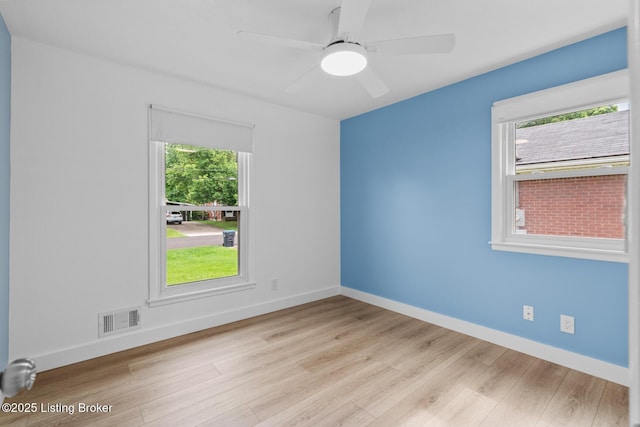 4900 Glenna Way, Louisville, KY 40219 - unfurnished room featuring healthy amount of natural light, wood finished floors, and a ceiling fan