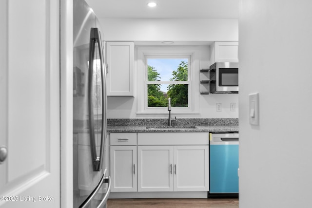 4900 Glenna Way, Louisville, KY 40219 - kitchen featuring stainless steel appliances, white cabinets, recessed lighting, dark stone counters, and light wood finished floors