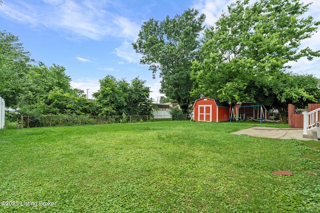 4900 Glenna Way, Louisville, KY 40219 - fenced backyard featuring a storage unit and a patio area