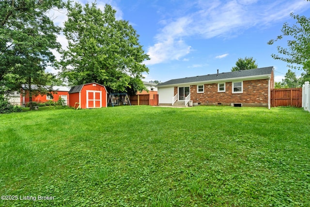4900 Glenna Way, Louisville, KY 40219 - back of house featuring entry steps, a fenced backyard, a shed, and brick siding