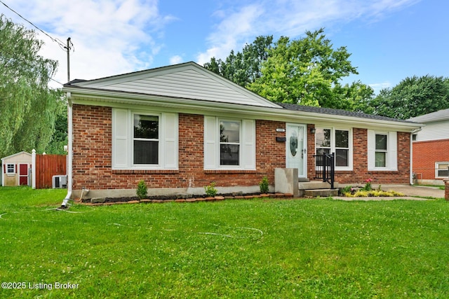 4900 Glenna Way, Louisville, KY 40219 - ranch-style home featuring a front lawn, brick siding, and a shed