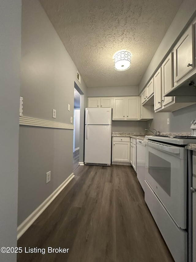 7070 Wildwood Cir Unit 154, Louisville, KY 40291 - kitchen with white appliances, dark wood-type flooring, a textured ceiling, white cabinets, and under cabinet range hood