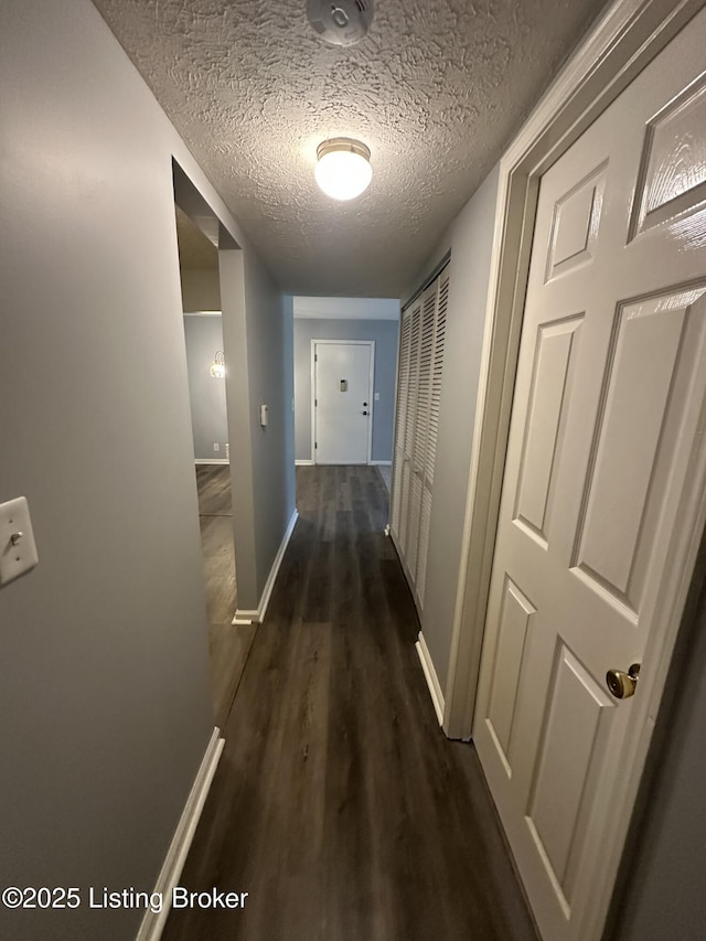7070 Wildwood Cir Unit 154, Louisville, KY 40291 - hall with dark wood finished floors and a textured ceiling