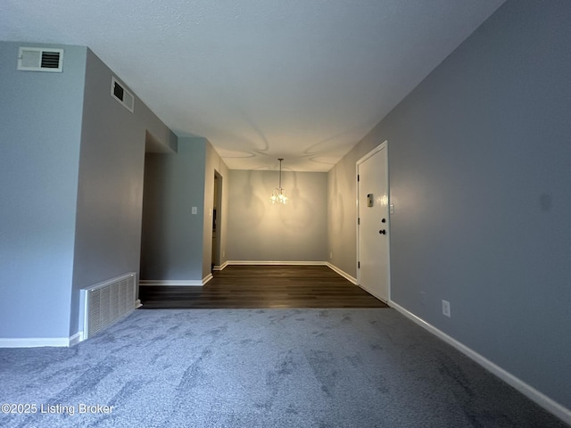 7070 Wildwood Cir Unit 154, Louisville, KY 40291 - unfurnished room with a chandelier and dark colored carpet