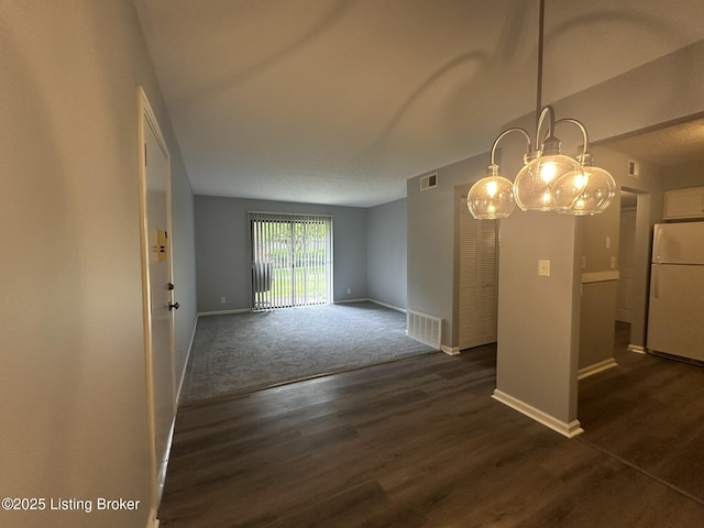 7070 Wildwood Cir Unit 154, Louisville, KY 40291 - unfurnished dining area featuring dark wood-type flooring and dark carpet