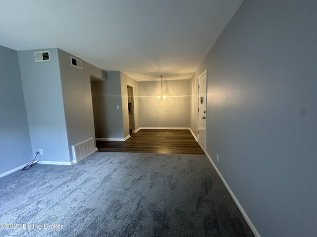 7070 Wildwood Cir Unit 154, Louisville, KY 40291 - empty room featuring a chandelier and dark carpet