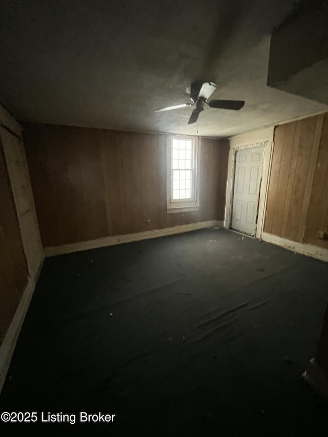 117 N 34th St, Louisville, KY 40212 - unfurnished bedroom featuring wooden walls and ceiling fan