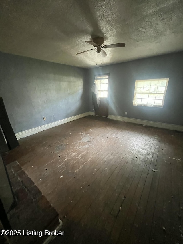 117 N 34th St, Louisville, KY 40212 - unfurnished room with a ceiling fan, a textured ceiling, and wood-type flooring