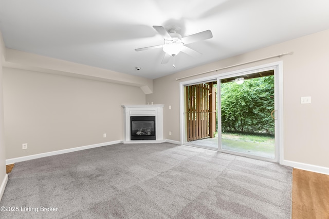 751 N Hite Ave Unit 2, Louisville, KY 40206 - unfurnished living room with a glass covered fireplace, ceiling fan, and carpet floors