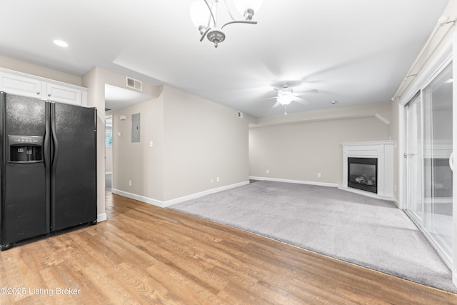 751 N Hite Ave Unit 2, Louisville, KY 40206 - unfurnished living room with ceiling fan, a glass covered fireplace, electric panel, recessed lighting, and light wood-type flooring