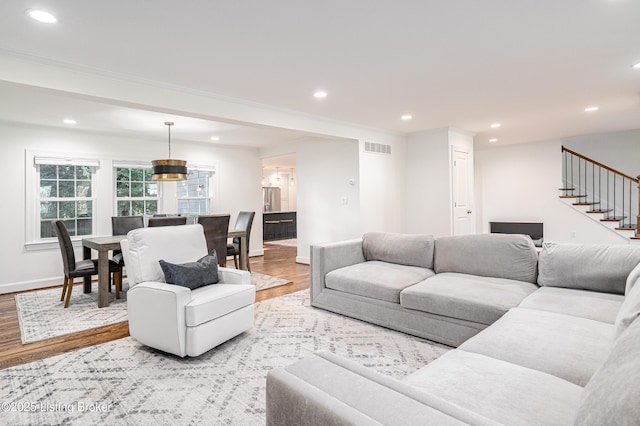 4022 Hycliffe Ave, Louisville, KY 40207 - living area featuring wood finished floors, stairs, and recessed lighting