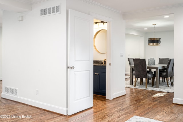 4022 Hycliffe Ave, Louisville, KY 40207 - hall featuring wood finished floors, ornamental molding, and recessed lighting