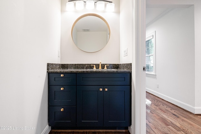 4022 Hycliffe Ave, Louisville, KY 40207 - bathroom featuring vanity, ornamental molding, and wood finished floors