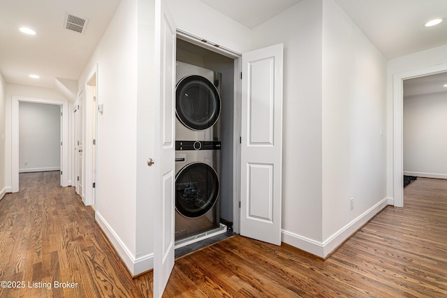 4022 Hycliffe Ave, Louisville, KY 40207 - laundry area featuring stacked washer and clothes dryer, wood finished floors, and recessed lighting