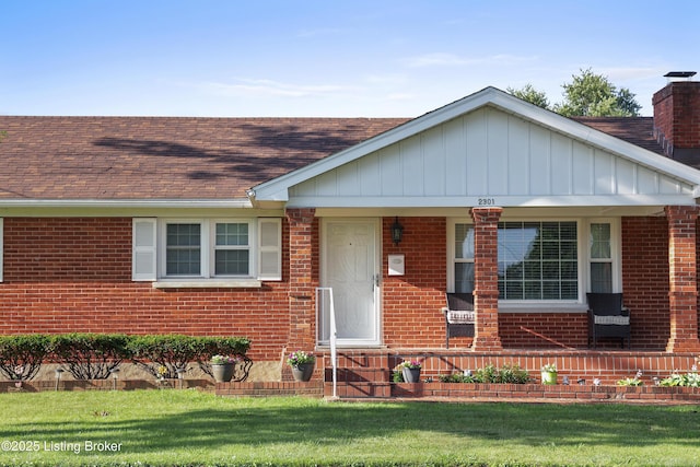 2301 Farnsley Rd, Louisville, KY 40216 - view of front of house with a chimney, roof with shingles, brick siding, a front lawn, and a porch