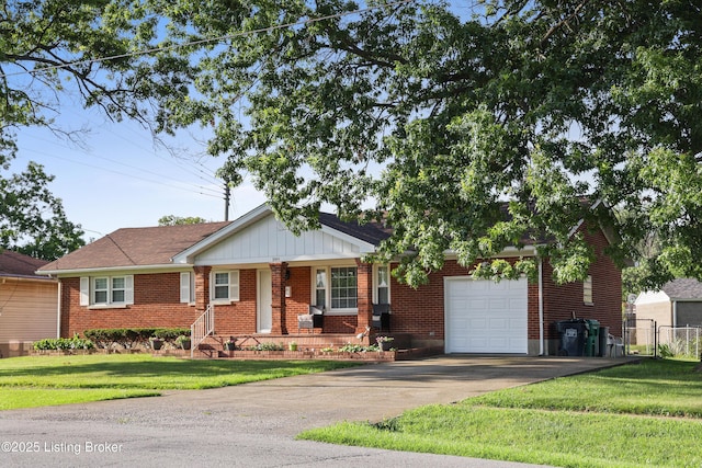 2301 Farnsley Rd, Louisville, KY 40216 - view of front facade featuring a garage, asphalt driveway, brick siding, and a porch