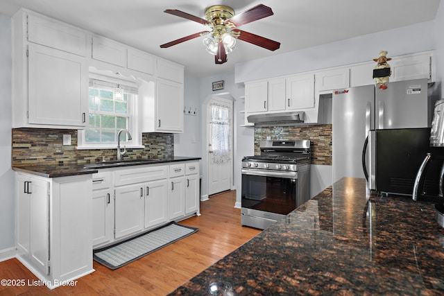 2301 Farnsley Rd, Louisville, KY 40216 - kitchen featuring stainless steel appliances, ceiling fan, white cabinets, and light wood-style flooring