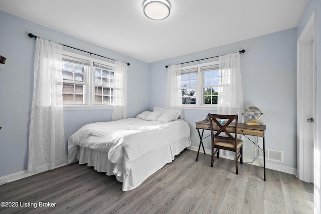 2301 Farnsley Rd, Louisville, KY 40216 - bedroom with wood finished floors and baseboards