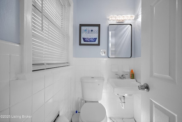 2301 Farnsley Rd, Louisville, KY 40216 - bathroom with a wainscoted wall and tile walls