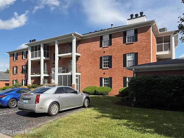 1305 Donard Park Ave, Louisville, KY 40218 - view of apartment building / complex featuring uncovered parking