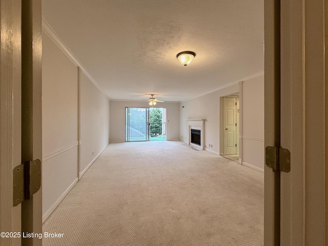 1305 Donard Park Ave, Louisville, KY 40218 - unfurnished living room featuring crown molding, carpet floors, a ceiling fan, a fireplace, and a textured ceiling