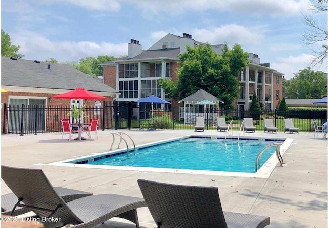 1305 Donard Park Ave, Louisville, KY 40218 - community pool featuring a patio area