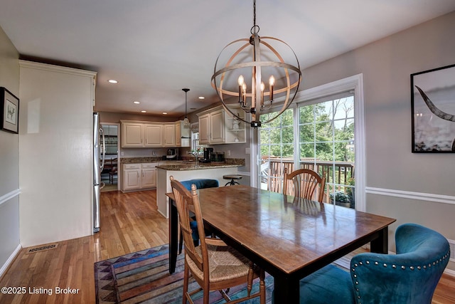 6011 Windsong Ct, Louisville, KY 40207 - dining space with a chandelier, light wood finished floors, and recessed lighting