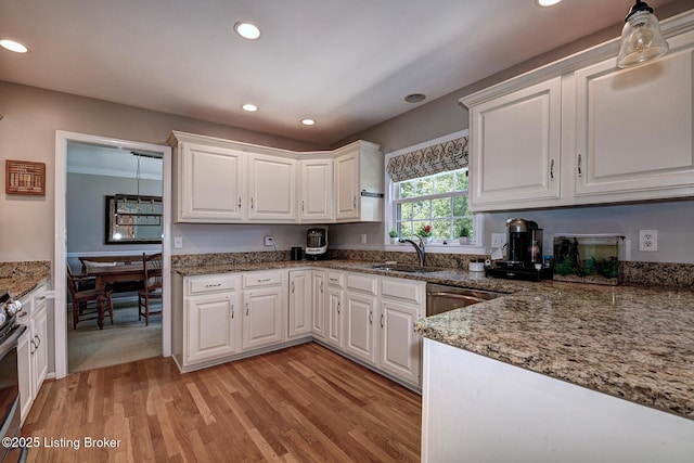 6011 Windsong Ct, Louisville, KY 40207 - kitchen with white cabinets, light wood-type flooring, recessed lighting, stone countertops, and stainless steel appliances