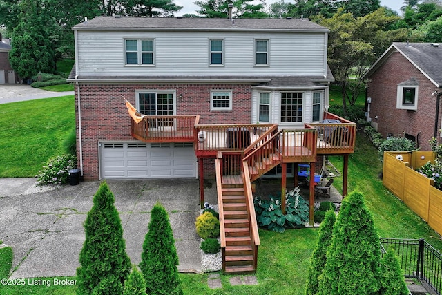 6011 Windsong Ct, Louisville, KY 40207 - back of property with stairs, driveway, an attached garage, brick siding, and a wooden deck