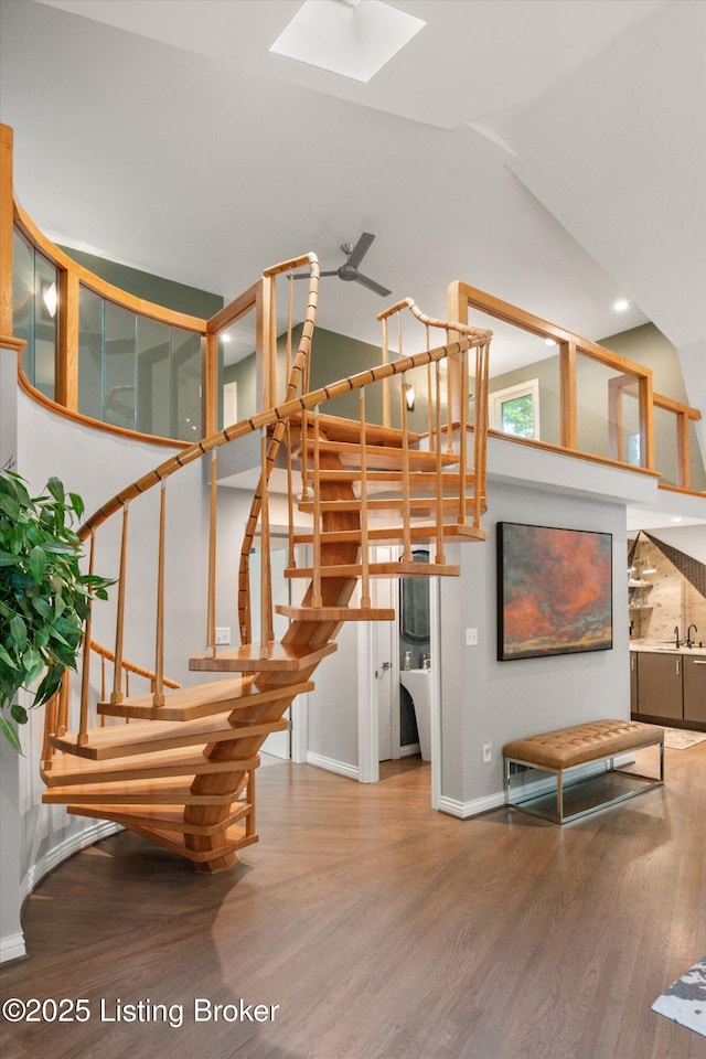 1430 Oakmont Ct, Shelbyville, KY 40065 - stairs featuring wood finished floors, a skylight, and high vaulted ceiling
