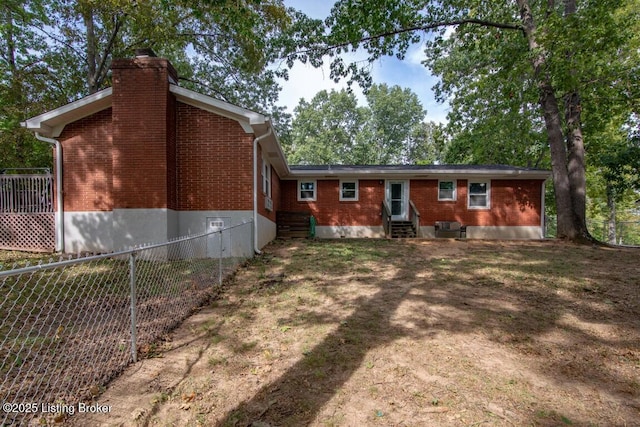 933 Lakeshore Pkwy, Brandenburg, KY 40108 - back of house with entry steps, brick siding, and a chimney